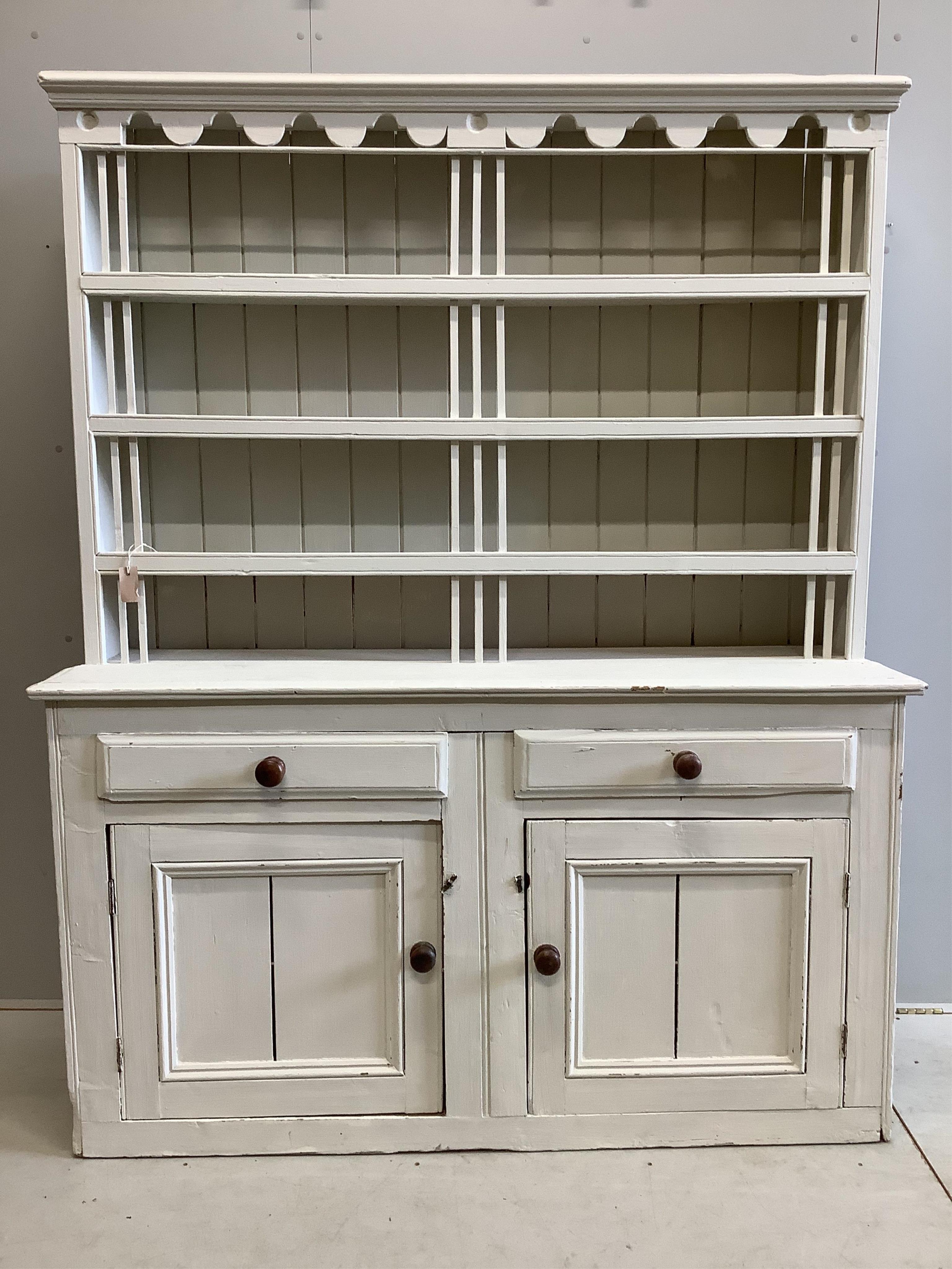 A 19th century Irish pine dresser with boarded rack, later painted, width 162cm, depth 49cm, height 201cm. Condition - fair